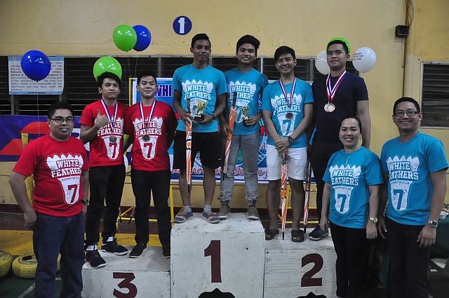 Winners of the Open category of the White Feathers Badminton Club Tournament pose with organizers.  (CONTRIBUTED)
