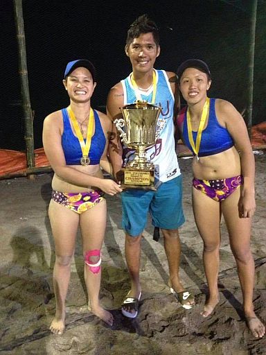 The tandem of Floremel Rodriguez (right) and Therese Rae Ramas of Southwestern University pose with their coach Dave Arreza after bagging  their second straight crown in  women’s beach volleyball in  the 21st Philippine University Games in Dumaguete City. (Contributed PHOTO)