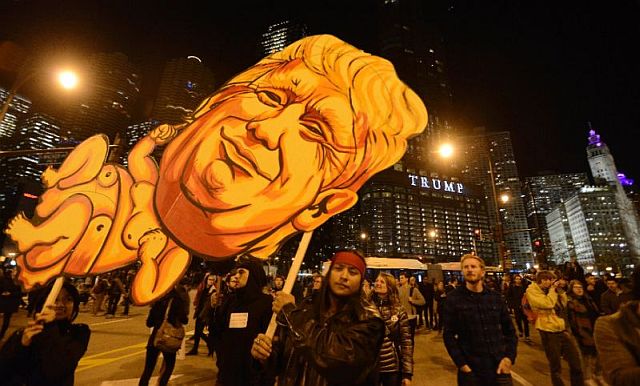 Protests against President-elect Donald Trump were held across the US, gathering thousands in cities including Chicago (pictured), New York and Philadelphia. (AFP)