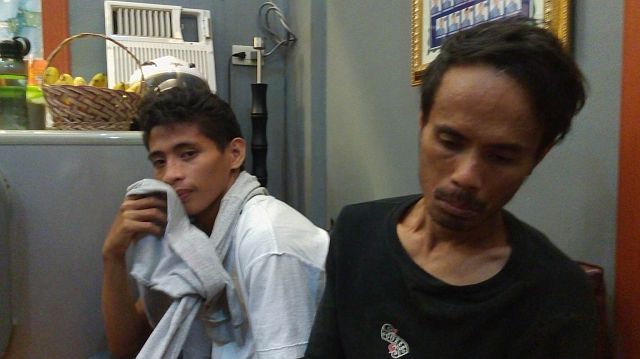  Jonito Lapata (right), 38, and Joshua Ortiz, 18, are both suspects in the killing of Milagros Lapata, 72-year-old mother to Jonito Lapata, in Gabuya street, Barangay Cogon-Pardo, Cebu City (CDN PHOTO/LITO TECSON). 