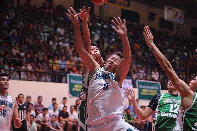 Cebu Landmasters/USJ-R Jaguars' Kevin Villafranca loses the ball as he drives to the basket against UV defenders (CDN PHOTO/RABBONI BORBON). 