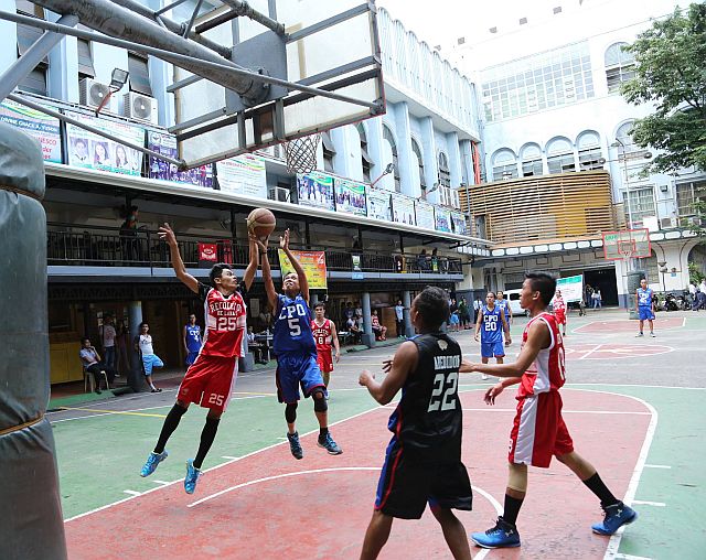 OLCPR's Angel Gulayan blocks the Campus Planners' Jason Mendez in this bit of action of the 11th Recoletos De Cebu Basketball League (RCBL) at the University of San Jose - Recoletos (USJ-R) main quadrangle (CDN Photo/Ioannes Arong).