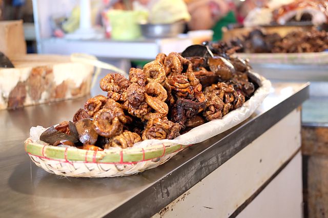 NOTHING AWFUL ABOUT  OFFAL. Deep fried  pork organs at the market:  intestines, heart, and liver!