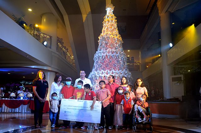 The management of Cebu Parklane International Hotel turns over a check worth P94,900 to Cancer Warriors Foundation Inc.–Cebu chapter (CONTRIBUTED PHOTO). 