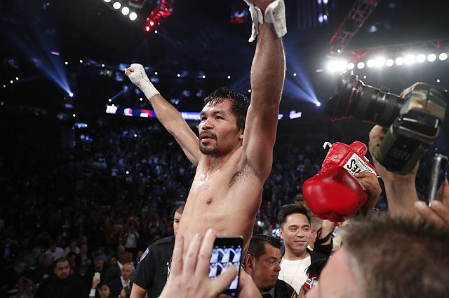 Manny Pacquiao, of the Philippines, celebrates after defeating Jessie Vargas in their WBO welterweight title boxing match Read more: http://sports.inquirer.net/228582/pacquiao-victorious-in-return-fight-against-vargas#ixzz4PCvuNStl  Follow us: @inquirerdotnet on Twitter | inquirerdotnet on Facebook (AP PHOTO).