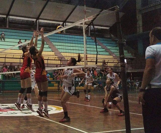 Spikers of Southwestern University and University of San Jose-Recoletos duke it out in Game 1 of the Cesafi women's volleyball best-of-three finals Sunday afternoon at the University of San Carlos Main Gym. (CDN PHOTO/ CHRISTIAN MANINGO)
