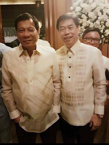 President Rodrigo Duterte is photographed with Cebuano businessman Peter Lim when they attended the wedding of the daughter of their common friend, Fernando “Ding”  Borja, in Cebu on July 17, 2016. (Photo from FACTS Against Ignorance Facebook account)