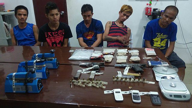 More than a  kilo of shabu was confiscated in a drug den resulting in the arrest of (right to left ) Jovenal Paayas, Eric Delos Nieves, Roy Viscayo, Elboy Alvez  and Reymond Villamor.  The illegal drugs were valued at P3.2 million.   Meanwhile, in Talisay City, another drug operation resulted in the confiscation of P2.4 million worth of shabu from suspected drug dealer Amber Banto.  (CDN PHOTO/LITO TECSON)