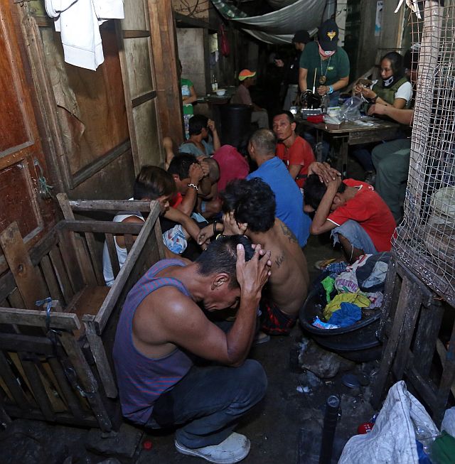 Drug suspects are arrested during a raid in Sitio Bato, Barangay Ermita in Cebu City. (CDN PHOTO/LITO TECSON)