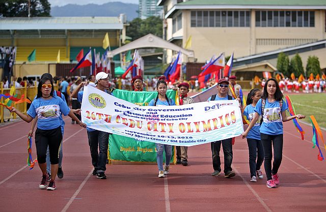 Participants from different units take part in the parade for the opening ceremony of the 2016 Cebu City Olympics at the Cebu City Sports Center. (CDN PHOTO/LITO TECSON)