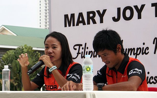 Mary Joy Tabal and her trainer John Philip Dueñas are spearheading a footrace which aims to help Barangay Guba Elementary School acquire more chairs. (CDN FILE PHOTO)