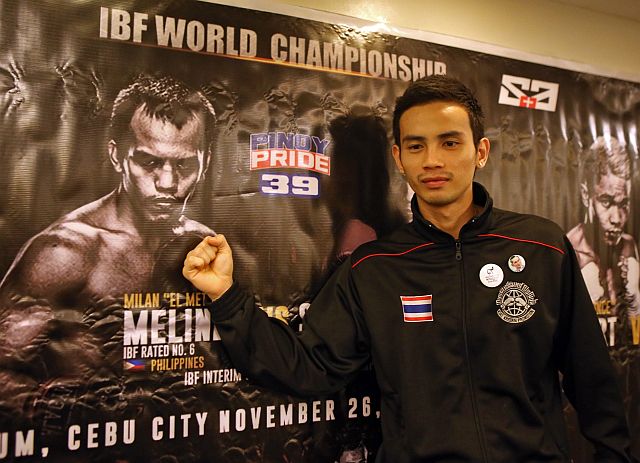 Fahlan  Sakkreerin of Thailand stands in front a poster of Milan “El Metodico” Melindo during a press conference at the St. Mark Hotel for the Pinoy Pride 39. Both square off this Saturday at the Cebu Coliseum. (CDN PHOTO/LITO TECSON)