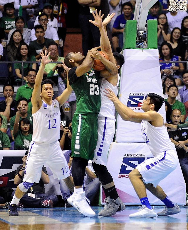 Former SWU Cobra Ben Mbala of La Salle is triple-teamed by the Ateneo defense in Game 2 of the UAAP men's basketball Finals.  (INQUIRER PHOTO/AUGUST DELA CRUZ)