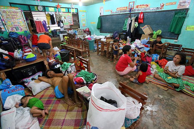 Fire victims of Barangay Duljo Fatima who are temporarily relocated to the San Nicolas Elementary School are asking for donations of clothes, mats and other household items. (CDN PHOTO/JUNJIE MENDOZA)