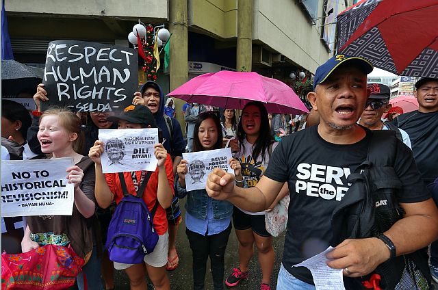 Militant students, teachers, drivers, farmers, laborers and women’s group who were members of Bayan-Central Visayas join the Nov. 25, 2016 nationwide Black Friday protest against the burial of Ferdinand Marcos at the Libingan ng mga Bayani  by holding a  rally in Colon Street, Cebu City. (CDN FILE PHOTO). 