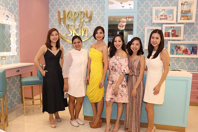 Happy Skin founders Jacque Yuengtian-Gutierrez (leftmost) and Rissa Mananquil-Trillp (third from left) pose with their staff at their first Happy Skin boutique in SM City Cebu. (CONTRIBUTED PHOTO)