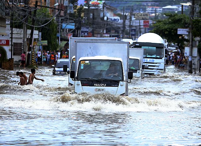 Heavy rains in July 2016 caused floods due partly to drainage clogged by plastic garbage in some parts of Mandaue City, prompting  the city government to enforce the plastic ban ordinance. (CDN PHOTO/LITO TECSON)