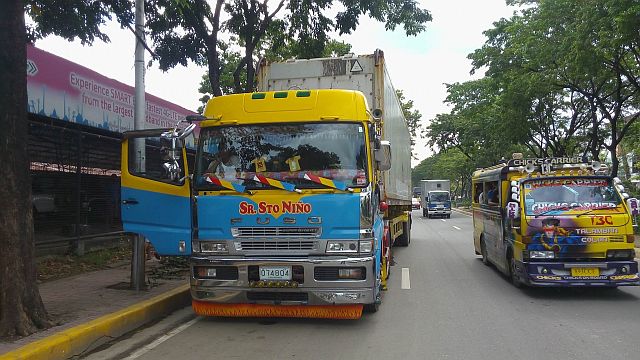 The container van truck that hit the overhead wires on New Imus Road. (CDN PHOTO/LITO TECSON)