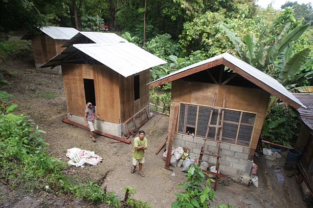 If plans of the city and the province of Cebu push through, Barangay Apas fire victims will soon find themselves in houses such as these built in a relocation site in Barangay Kalunasan — a mountain village with steep and winding roads reached only through motorcycles-for-hire, locally known as habal-habal. (CDN PHOTO/TONEE DESPOJO). 