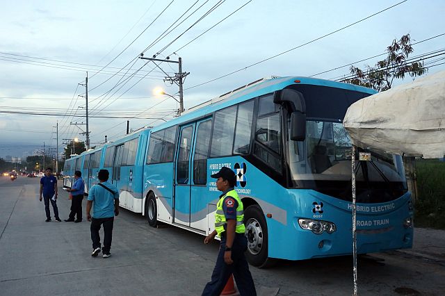  Workers assemble the hybrid train of the Department of Science and Technology (DOST) in front of the Cebu City Transportation Office at the North Reclamation Area. (CDN Photo/Junjie Mendoza). 