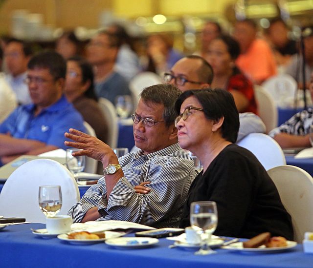 DENR Undersecretaries Isabelo Montejo and Sylvia Ordoñez listen to the presentation of mangrove consultant Dexter Cabahug during the symposium on Mangroves for Climate Adaptive and Resilient Communities in Visayas at the Waterfront Cebu City Hotel. (CDN PHOTO/LITO TECSON)