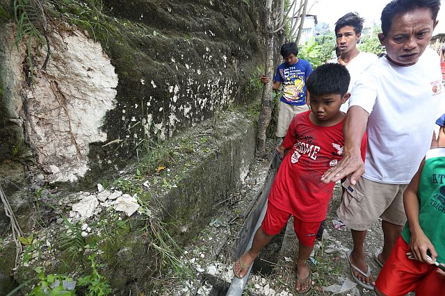 A firecracker, which people in the area believed was an improvised explosive, damaged a portion of a canal located outside the Cebu Provincial Detention and Rehabilitation Center in Barangay Kalunasan, Cebu City (CDN PHOTO/JUNJIE MENDOZA). 