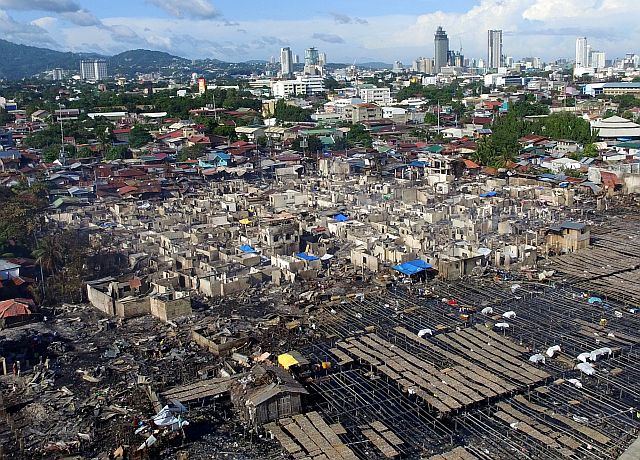 razed to the ground. Over 500 houses are now gone, leaving nearly 3,000 people homeless, following a seven-hour fire that hit this erstwhile densely populated community in Barangay Duljo Fatima, Cebu City, starting at 11:14 p.m. on Thursday, Dec. 1, 2016, until past 6 a.m. the next day. (CDN DRONE PHOTO/TONEE DESPOJO). 