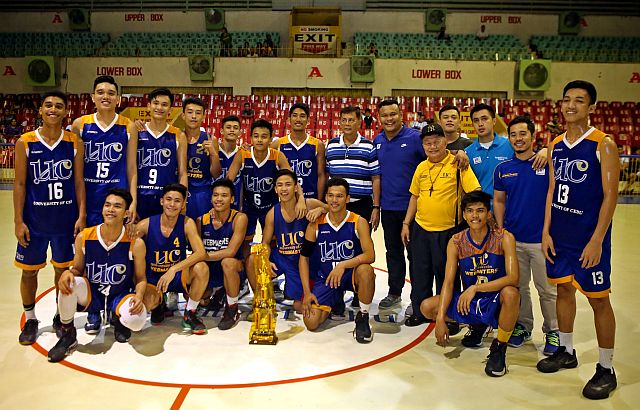 The University of Cebu Baby Webmasters gather at center court after receiving the championship trophy in the Under-17 division of the Cebu Friendship Invitational Basketball Cup 2016 last Wednesday night at the Cebu Coliseum. (CDN PHOTO/LITO TECSON)