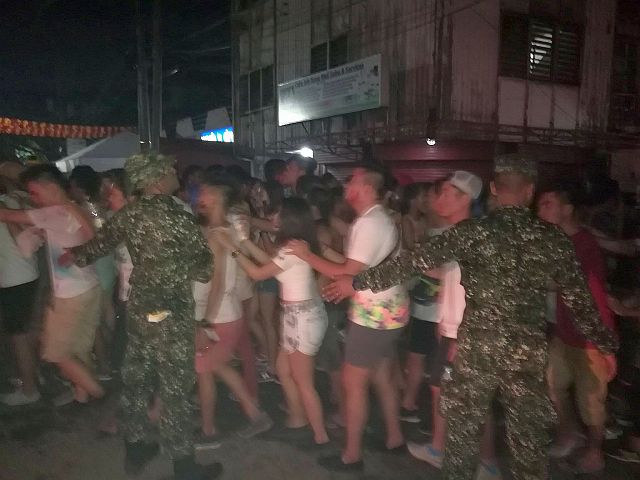 Mariners usher a crowd in Osmeña Juana Street during Sinulog (CDN PHOTO/CHRISTIAN MANINGO). 