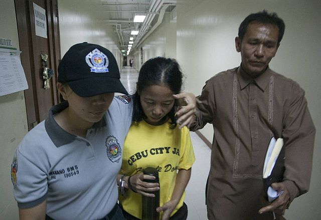 A female BJMP personnel (left) escorts Jocelyn B. Cardona (center) after she was ordered released by Judge Jose Nathaniel Andal of RTC branch 24 on Wednesday afternoon. With them is Jocelyn B. Cardona's legal counsel Atty. Glen Villariza. (CDN PHOTO/CHRISTIAN MANINGO)