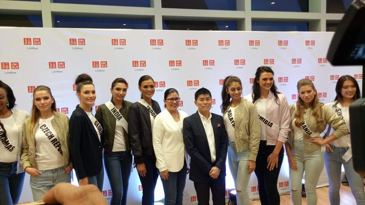 Uniqlo chief operations officer Katsumi Kubota (center) poses with the twelve Miss Universe 2016 candidates who visited the shop in SM Seaside City Cebu on Tuesday afternoon. (CDN PHOTO/TRICIA RODRIGO)