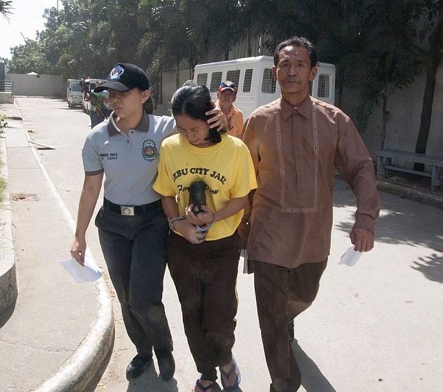 Jocelyn Cardona being led to prison by CIDG agents. (CDN PHOTO/CHRISTIAN MANINGO)