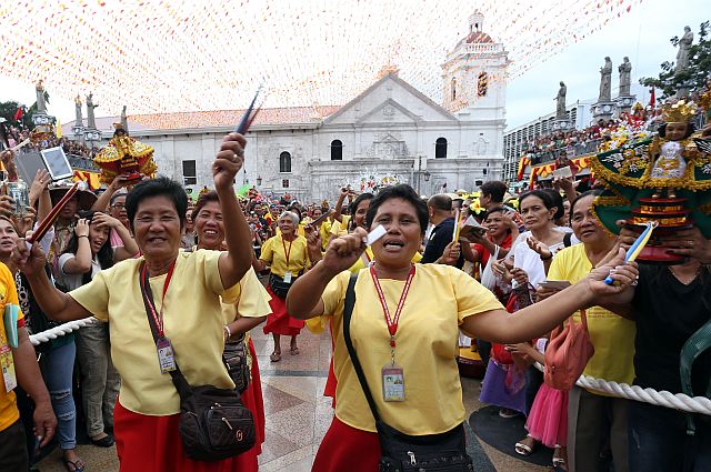 Hundreds gathered inside and outside the Basilica Minore del Santo Niño in downtown Cebu City on a starless night on Saturday, clouds hiding the moon from view, only to lift their hands to call out to the Holy Child. 
