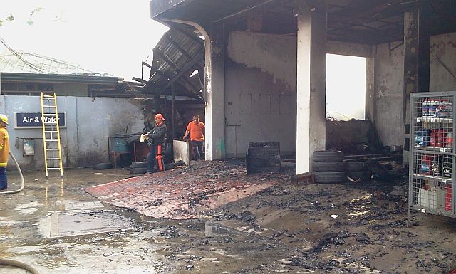 The service bay area of Petron gas station in Barangay Canjulao in Lapu-Lapu City was partially damaged by fire that started at the employees' quarters of the gasoline station. (CDN PHOTO/NORMAN MENDOZA)