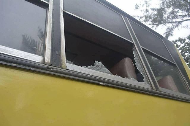 A broken glass window of Samar Bus Line indicates which part of the bus the shooting took place early morning of Thursday. (ROBERT DEJON)