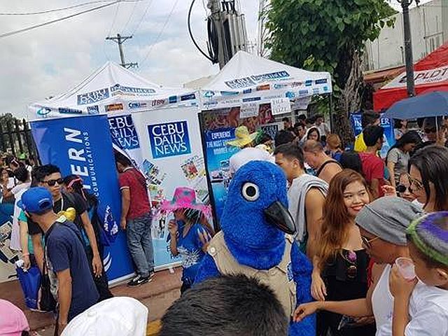 CDN's very own mascot, Siloy, also visited the booth adding more attraction, encouraging more passing revelers to stop by and take a photo with him. (CDN PHOTO/DOMINIC D. YASAY)