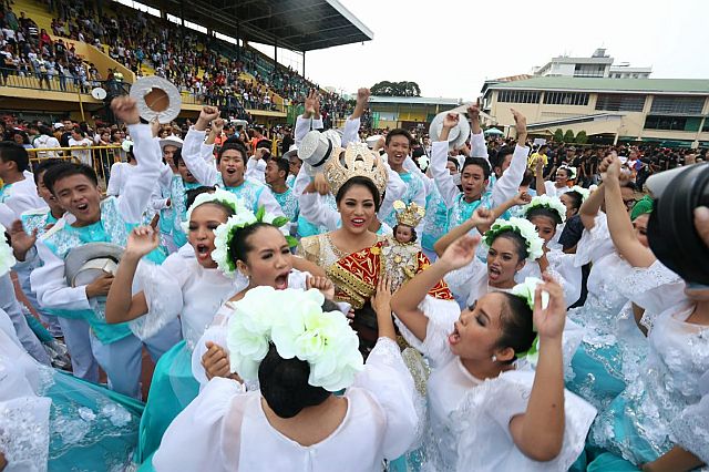 Tuburan National High School dancers celebrates after winning the Best in Ritual Showdown prize in this year's Sinulog sa Kabataan sa Lalawigan. (CDN PHOTO/JUNJIE MENDOZA)