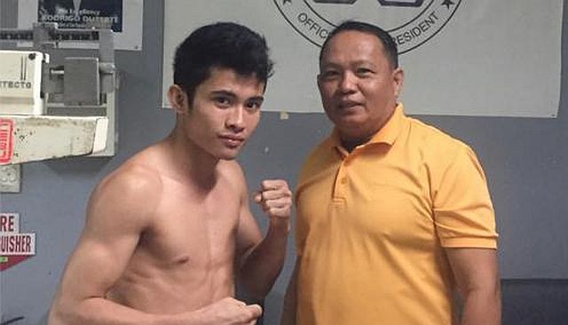 Melvin Jerusalem poses after the mandatory weigh-in conducted by Games and Amusement Board-Cebu City supervisor Rolando Mendoza. (CONTRIBUTED PHOTO/EDITO VILLAMOR)