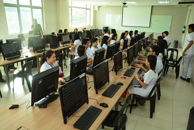 Students from a partner school using ThinkCentre M73 Tiny Desktops through Lenovo’s ‘Think University’ program. (CONTRIBUTED PHOTO) 