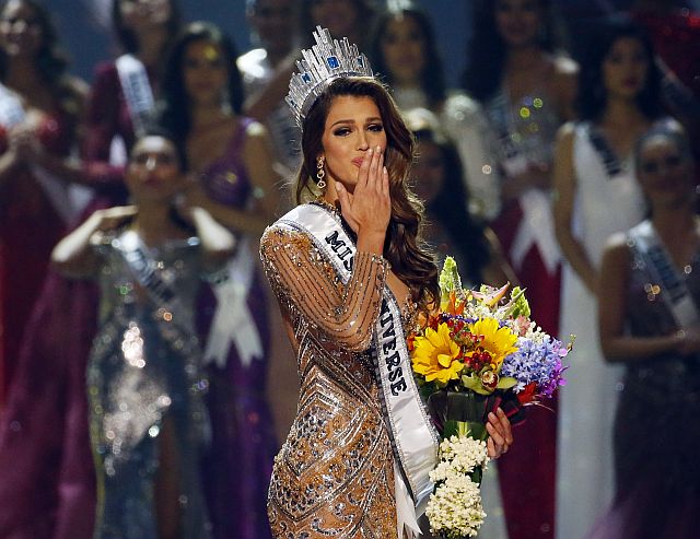 Iris Mittenaere of France blows kisses to the crowd after being proclaimed the Miss Universe 2016 in coronation Monday, Jan. 30, 2017, at the Mall of Asia in suburban Pasay city, south of Manila, Philippines. (AP Photo/Bullit Marquez)