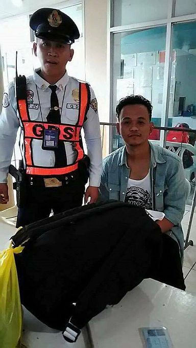 Joel Guillena is shown with the security guard who brought him to police. (CONTRIBUTED PHOTO)