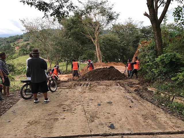 Cracks and gaps in the road at Sitio Tawagan, Barangay Sirao were filled with soil to make it passable to vehicles.  (Contributed photo/DPWH) 