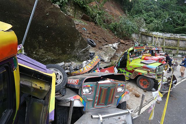 BUSAY LANDSLIDE. These public utility jeepneys (PUJs) and a a car (below) are among the 12 vehicles that are buried in a landslide that occurred at around 2 a.m. on Wednesday, Jan. 18, 2017, in Sitio Garahe, Upper Busay, a landslide-prone area. (CDN PHOTO/JUNJIE MENDOZA)