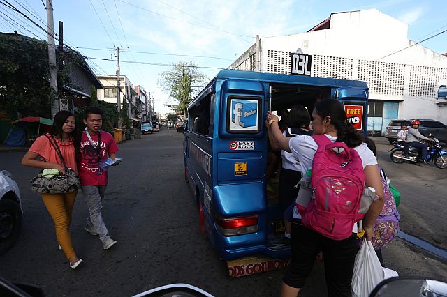 SILOY IS WATCHING: Passengers rush to board on this passenger jeepney that stop at a"No PUJ Stop" that creats a traffic to the following vehicles at Lapu lapu street corner Urdaneta street.ATTENTION: CCTO MAY BE THIS DRIVER NEEDS ANOTHER TRAFFIC DRIVING SEMINAR