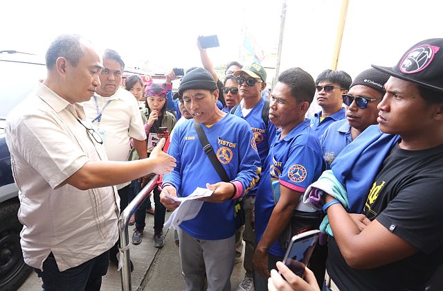 LTFRB-7 Regional Director Ahmed Cuizon receives a copy of the 'Pagkakaisa ng Samahan ng mga Tsuper at Opereytor Nationwide' (PISTON) complaint  on the alleged phasing out of 15-year old jeepneys.