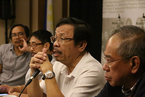 Director Exequiel Sarcauga (second from right) with Philip Tan, RTWPB-7 discusses the labor regularezation problem during the 888 News forum at Marco Polo Plaza. (CDN PHOTO/ JUNJIE MENDOZA) 