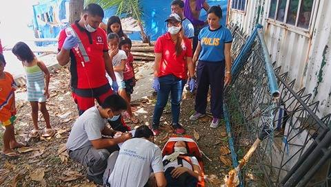 Mary Grace Palomares, 41, of Barangay Mactan, Lapu-Lapu City was attended to by rescue personnel after she jumped off Marcelo Fernan Bridge.