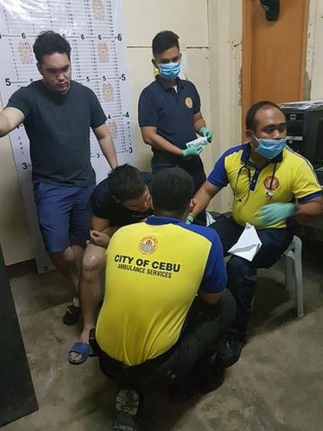 Dr. Julian Iñaki Larrazabal-Garcia is treated by medics inside the Carcar Police Station shortly after his  release by his abductors on Saturday morning. (CONTRIBUTED PHOTO)