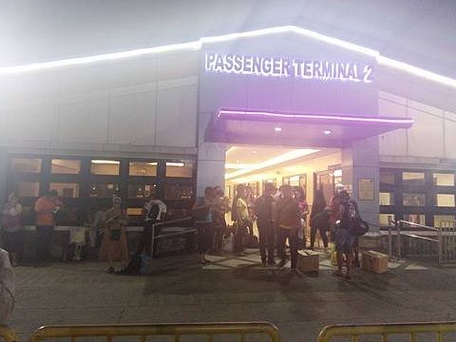 Stranded passengers wait for updates at the Terminal. (CDN PHOTO/FE MARIE DUMABOC)