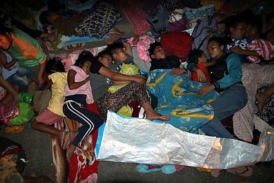 This picture taken on Feb. 11, 2017, shows Surigao City residents sleeping on the pavement on the grounds of the Provincial Capitol where they take shelter from strong aftershocks of the 6.7-magnitude earthquake that hit Friday night, Feb. 10,2017.  